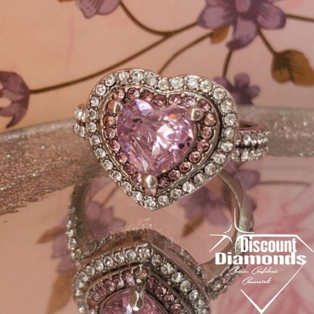 Pink Sapphire surrounded by White Baguette Diamonds on 925 Sterling Silver
